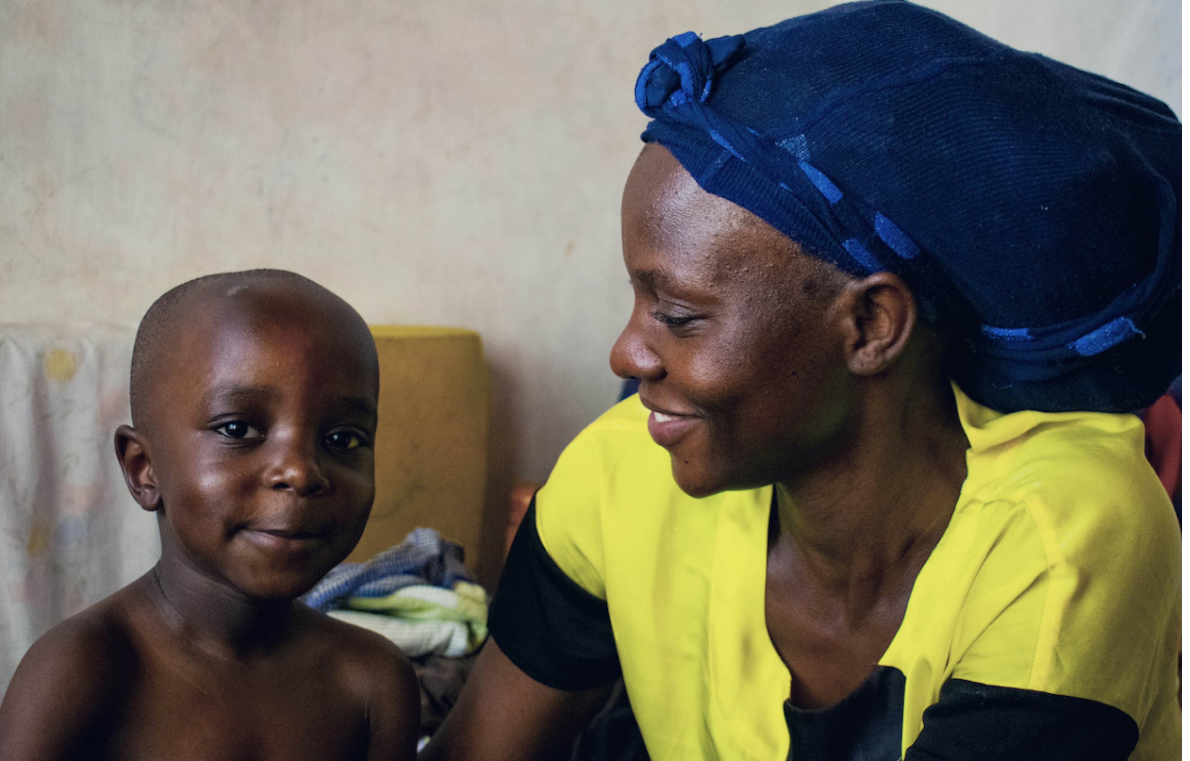 Mother and child receiving care in a health setting